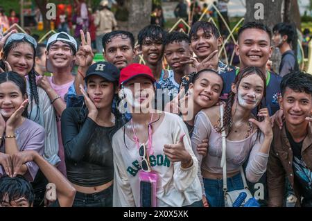 young Cambodians / revellers pose for a photo during The Cambodian New Year festival. Wat Phnom, Phnom Penh, Cambodia. © Kraig Lieb Stock Photo