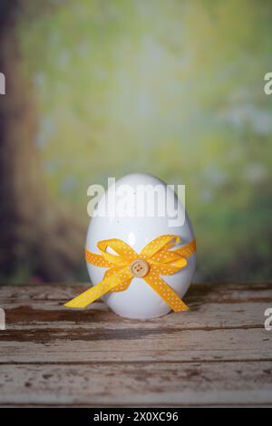 Eggs wrapped in a colorful gift tie. Easter, Pascha or Resurrection Sunday concept Stock Photo