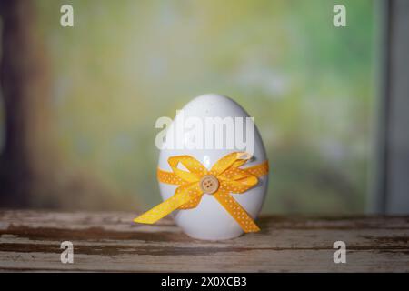 Eggs wrapped in a colorful gift tie. Easter, Pascha or Resurrection Sunday concept Stock Photo