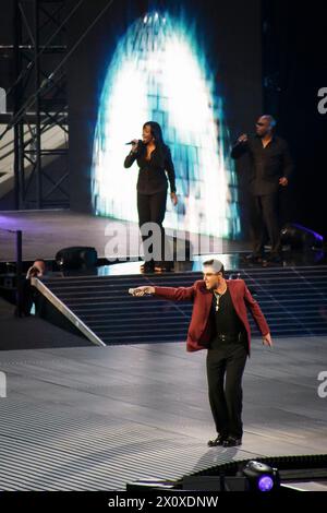 George Michael performing in concert at the opening night of the new Wembley Stadium London, England Stock Photo