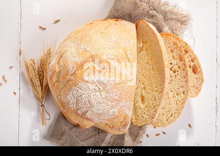 Crispy and rustic round loaf bread freshly baked in bakery. Rustic loaves of bread. Stock Photo