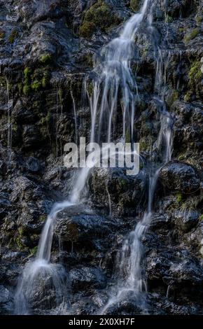 A waterfall cascading down rocks into the Sooke River in Sooke Potholes Regional Park in British Columbia, Canada. Stock Photo