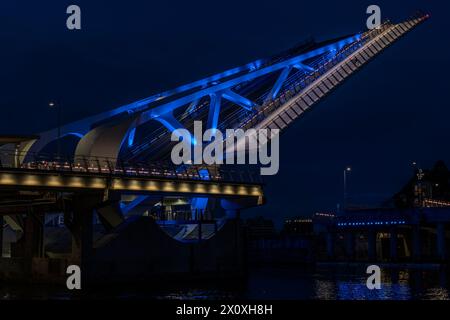 The Johnson Street Bridge in Victoria, British Columbia, Canada, seen before dawn elevated for a ship to pass. Stock Photo