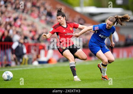Manchester United's Lucia Garcia (left) and Chelsea's Niamh Charles battle for the ball during the Adobe Women's FA Cup semi-final match at Leigh Sports Village. Picture date: Sunday April 14, 2024. Stock Photo