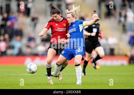 Manchester United's Lucia Garcia (left) and Chelsea's Erin Cuthbert battle for the ball during the Adobe Women's FA Cup semi-final match at Leigh Sports Village. Picture date: Sunday April 14, 2024. Stock Photo
