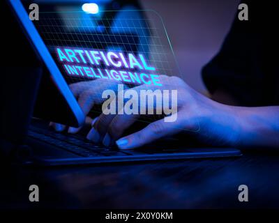 AI generated tools website, futuristic technology. Text "Artificial Intelligence" on virtual screen while businessman's hand work with laptop computer Stock Photo