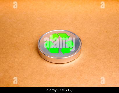 Green recycle icon symbol on round silver plate on brown kraft paper background. Ecology, sustainability cooperation, reduce, reuse and recycle concep Stock Photo