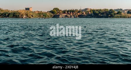 Green Nile bank landscape with Fatimid cemetery in the background near Aswan Stock Photo