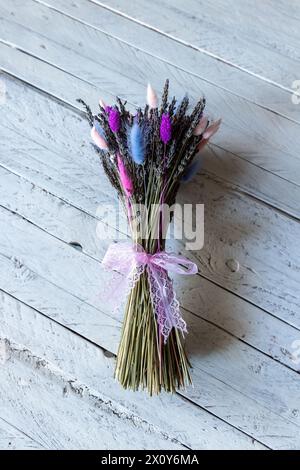 Direct above shoot of a lavender bouquet over white wooden table. Stock Photo
