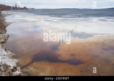 Ice drift in spring on Lake Onega, Karelia. Dangerous thin spring ice in April. Aggregate accumulations of fine-crystalline grains. Opening of small l Stock Photo