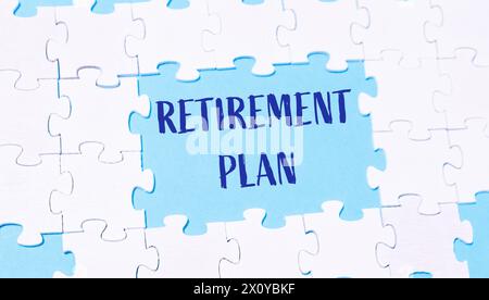 A puzzle piece with the words retirement plan written in blue, representing the importance of thoughtful financial preparation for the future. Stock Photo