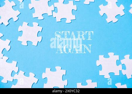 A puzzle with the words start again written on it Stock Photo