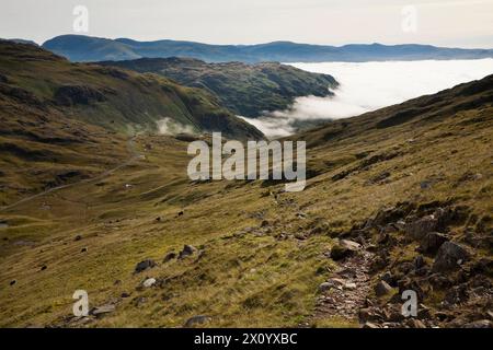 The footpath leading from Wet Side Edge down to Wrynose Pass in the English Lake District Stock Photo