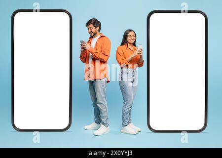 Smartphone mockup with couple using phones on blue background Stock Photo