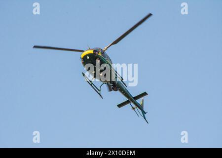 An American Eurocopter AS350B2 helicopter operated by the Los Angeles County Sheriff's Department flies overhead Stock Photo