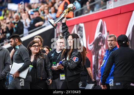 Harrison, United States. 14th Apr, 2024. Harrison, United States, April 14, 2024: Ali Krieger carries out the 2023 NWSL Championship trophy before the National Women's Soccer League match between Gotham FC and Kansas City Current at Red Bull Arena in Harrison, NJ United States (EDITORIAL USAGE ONLY). (Rebekah Wynkoop/SPP) Credit: SPP Sport Press Photo. /Alamy Live News Stock Photo