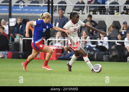 Columbus, Ohio United States. 9th April, 2024.  Canada midfielder Simi Awujo (13) handles the ball against USA midfielder Lindsey Horan in the final match of the SHeBelieves Cup in Columbus, Ohio, USA. Credit: Brent Clark/Alamy Live News Stock Photo