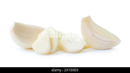 Front view of fresh white garlic cloves with half and slices in stack is isolated on white background with clipping path. Stock Photo