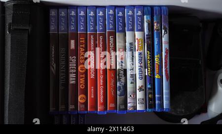 Playstation 4 physical game and blu-ray disks arranged in a drawer Stock Photo