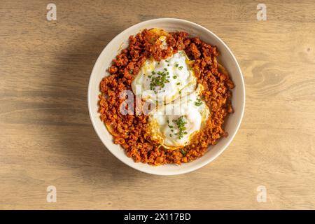 huevos rotos con chorizo tapas spanish dish top view Stock Photo