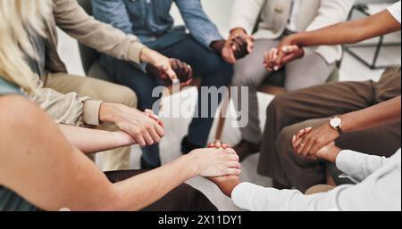 People, group and therapy for mental health, holding hands and listening with advice, empathy and kindness. Conversation, men and women with Stock Photo