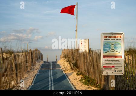 Fort Matanzas National Monument beach access with warning signs and flag on Anastasia Island in Northeast Florida. (USA) Stock Photo