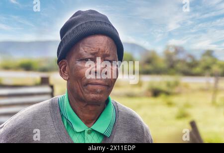 portrait of an old african man in the yard in south african village Stock Photo