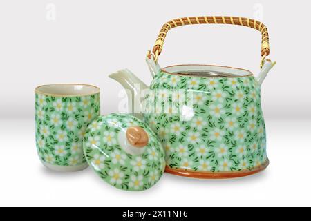 Beautiful Asian Tea Pot and Cup Set with Floral patterns Mockup Stock Photo