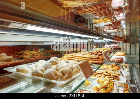 Delectable Assortment of Pastries and Sweets on Display at a Bakery Shop Stock Photo