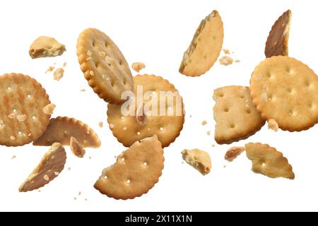 Tasty dry crackers falling on white background Stock Photo