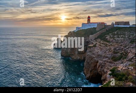 moody view on Cabo Sao Vicente with its famous lighthouse at sunset at the south.estern spit of Europe near Sagres, Algarve, Portugal Stock Photo