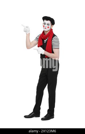 Funny mime artist in beret pointing at something on white background Stock Photo