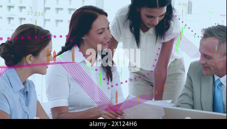 Image of financial data processing over diverse businesspeople discussing together at office Stock Photo