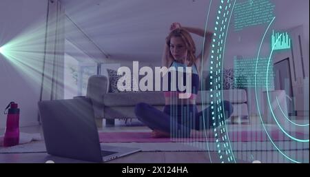 Image of data processing over caucasian woman, exercising using laptop Stock Photo