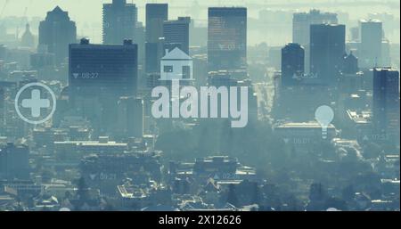 Image of icons and financial data processing over cityscape Stock Photo