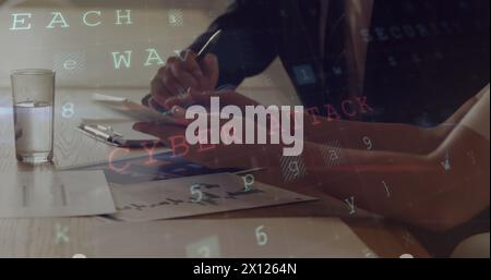 Digital composite of business people working on a tablet and codes in the foreground Stock Photo