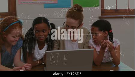 Image of math formulas moving over diverse female teacher and pupils working on laptop Stock Photo
