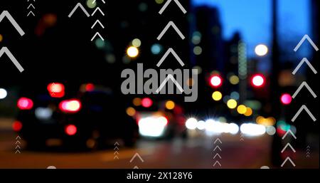 Image of multiple up arrows over blurred vehicles moving on street in city Stock Photo