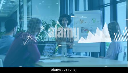 Image of graphs, loading bars, map, diverse woman explaining strategy to coworkers on whiteboard Stock Photo