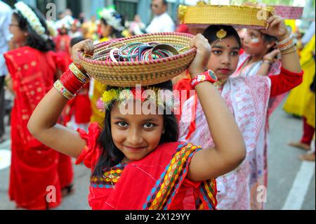 Sylhet, Bangladesh. 14th Apr, 2024. April 14, 2024, Sylhet, Bangladesh: A woman takes part during the Pathshala, the Bengali New Year 1431 Celebration ceremony in the first light of the dawn of Pahela Baisakh at the premises. Credit: Eyepix Group/Alamy Live News Stock Photo