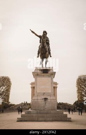 Medieval statue of a knight on a horse made of stone in Montpellier Stock Photo