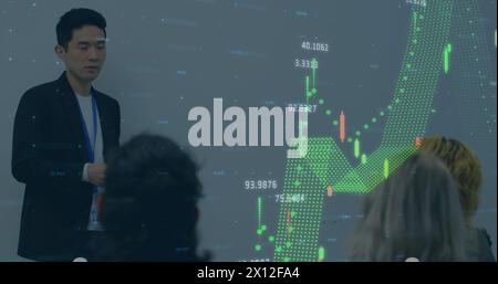 Image of financial data over asian businessman making presentation Stock Photo