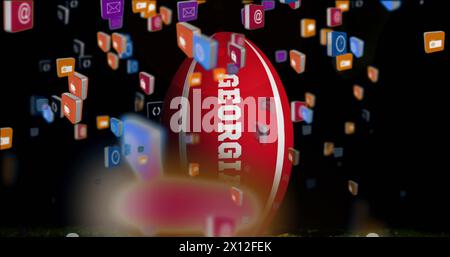 Image of media icons over rugby ball with georgia text on black background Stock Photo