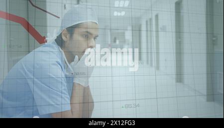 Image of data processing over biracial male doctor sitting Stock Photo