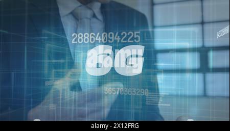 Image of 6g and numbers over caucasian businessman using tablet Stock Photo