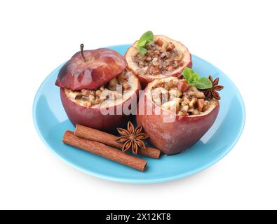 Tasty baked apples with nuts, honey, spices and mint isolated on white Stock Photo