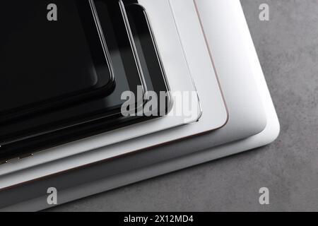 Many different modern gadgets on grey table, closeup Stock Photo