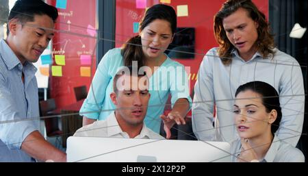 Business executives are working on computers in an office Stock Photo
