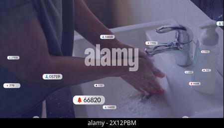 Image of media icons over caucasian woman washing hands Stock Photo