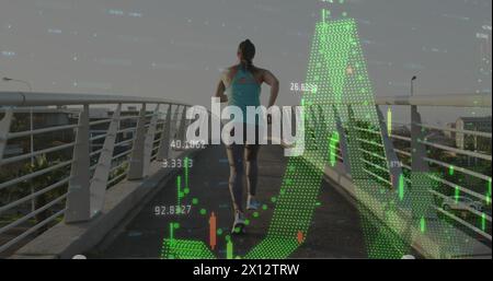 Image of multiple graphs with changing numbers, rear view of caucasian woman running outdoors Stock Photo